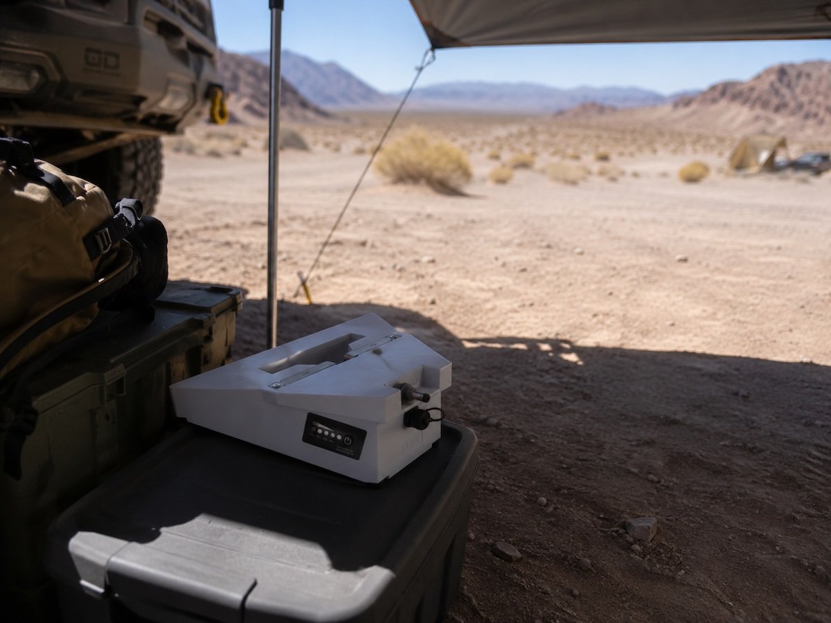 SINVYX battery placed in shade at a desert campsite instead of direct sun